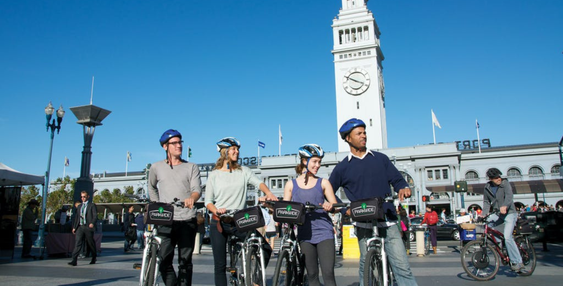 two couples on bike rentals at the entrance to golden gate park