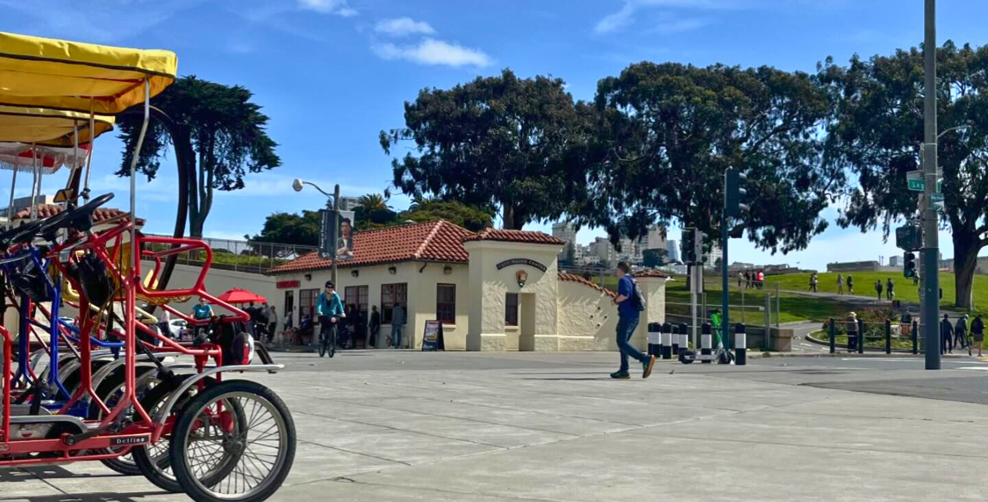 surrey bike rentals lined up at entrance to golden gate park