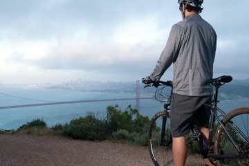 riding over a hill overlooking the golden gate bridge