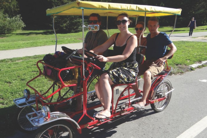 group of four riding on a surrey in san francisco